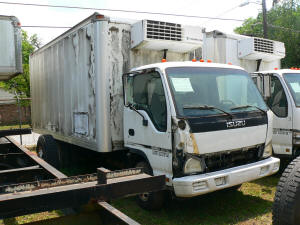 1064, 2006 Isuzu NPR used parts truck